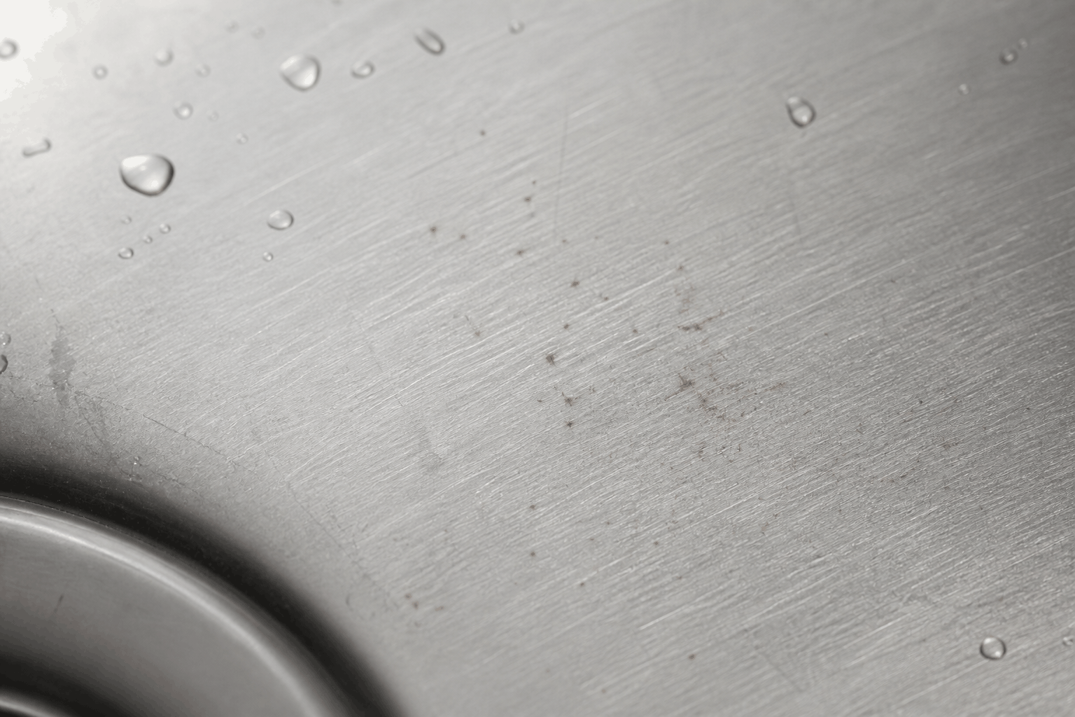 iron-transfer-specks-stainless-sink.png